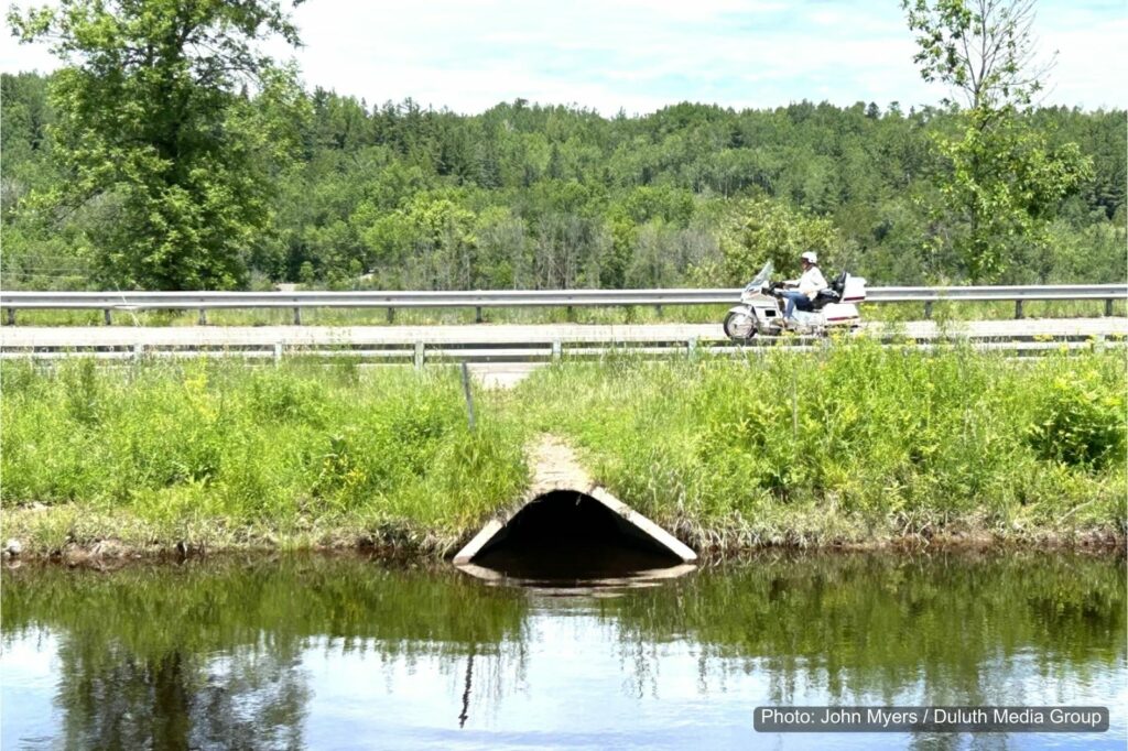 A small culvert with a road over top and water below